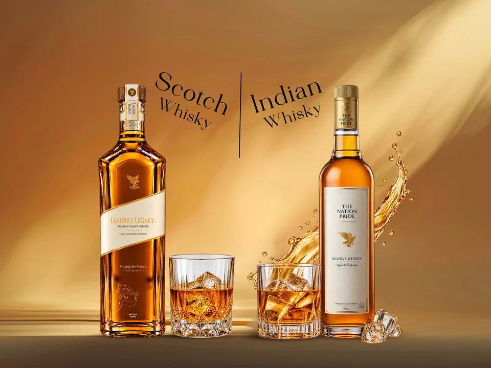 Two whisky bottles labeled scotch and indian whisky with glasses and ice on a golden background