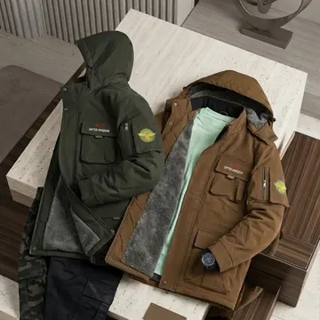 Two winter jackets with fleece lining displayed on a marble and wood bench