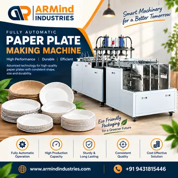 A paper plate making machine with stacks of white and brown plates and green leaves around