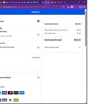 Walmart checkout screen displaying delivery info and payment methods for an order totaling $33.12