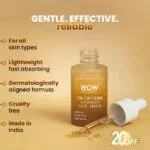Golden serum bottle with dropper and spilled drops on beige background with promotional text