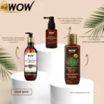 Three WOW hair care bottles on white pedestals with palm leaves and beige background