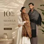 Couple wearing shawls near a vase with promotional text for 10% off