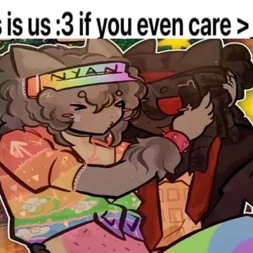 Two cartoon characters with cat ears embrace warmly against a rainbow background with hearts and stars