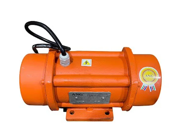Orange industrial vibratory motor with black cable and warning labels