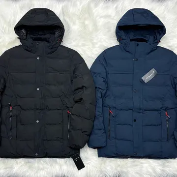 Two winter puffer jackets black and navy blue with red zippers on white fur