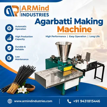 Green and silver agarbatti making machine with incense sticks and flower on blue background