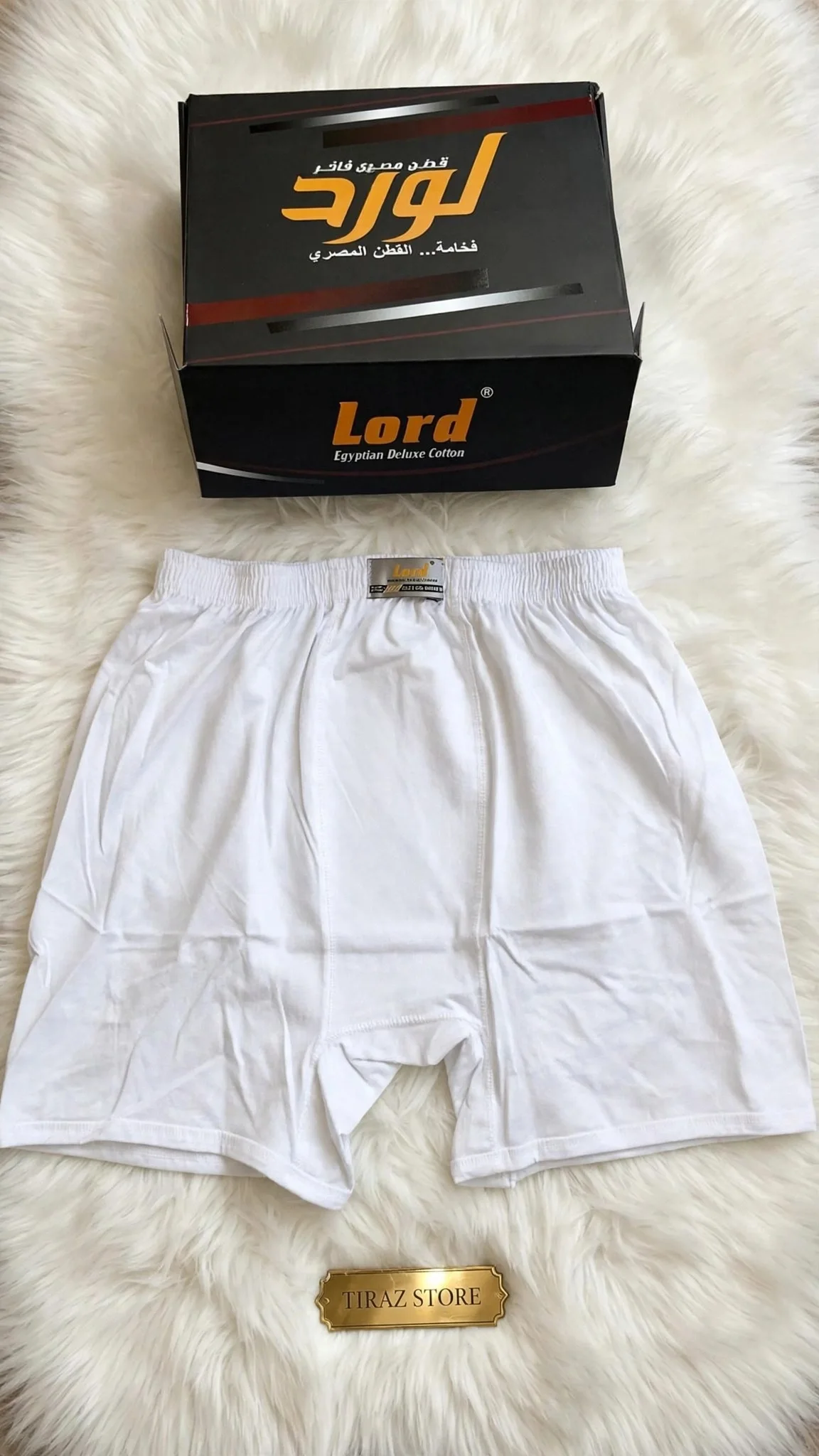 White Lord brand boxers and packaging on fluffy white fur with gold store plaque