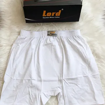 White Lord brand boxers and packaging on fluffy white fur with gold store plaque